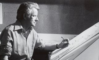 Robin Day working at his drawing board