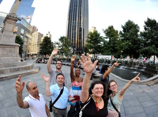 Members of the Amateur Astronomers Association of New York gathered for a "flash mob" in Columbus Circle to wave at Saturn on July 19, 2013.