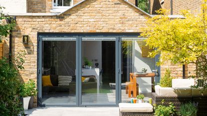 Exterior of brick house with extension and bifolding doors