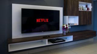 Netflix logo on TV screen in contemporary living room