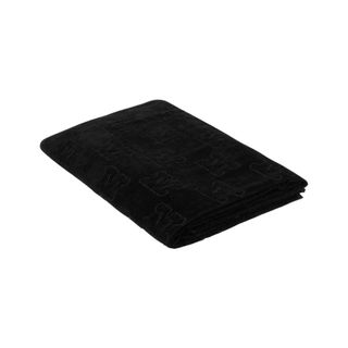 folded monogrammed black towel