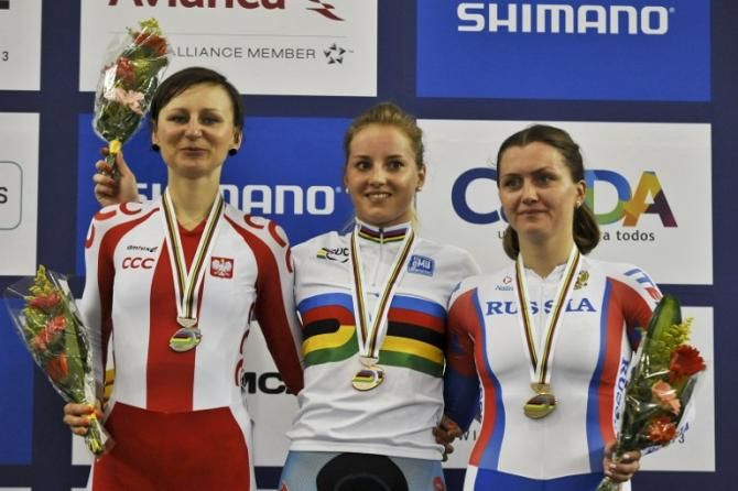 Belgium's Kelly Druyts (C), gold; Poland's Katarzyna Pawlowska (L) silver; and Russian Evgenia Romanyuta bronze, pose on the winner's podium of the Women's Scratch Race