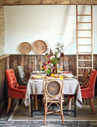 Country dining room with orange velvet upholstered chairs