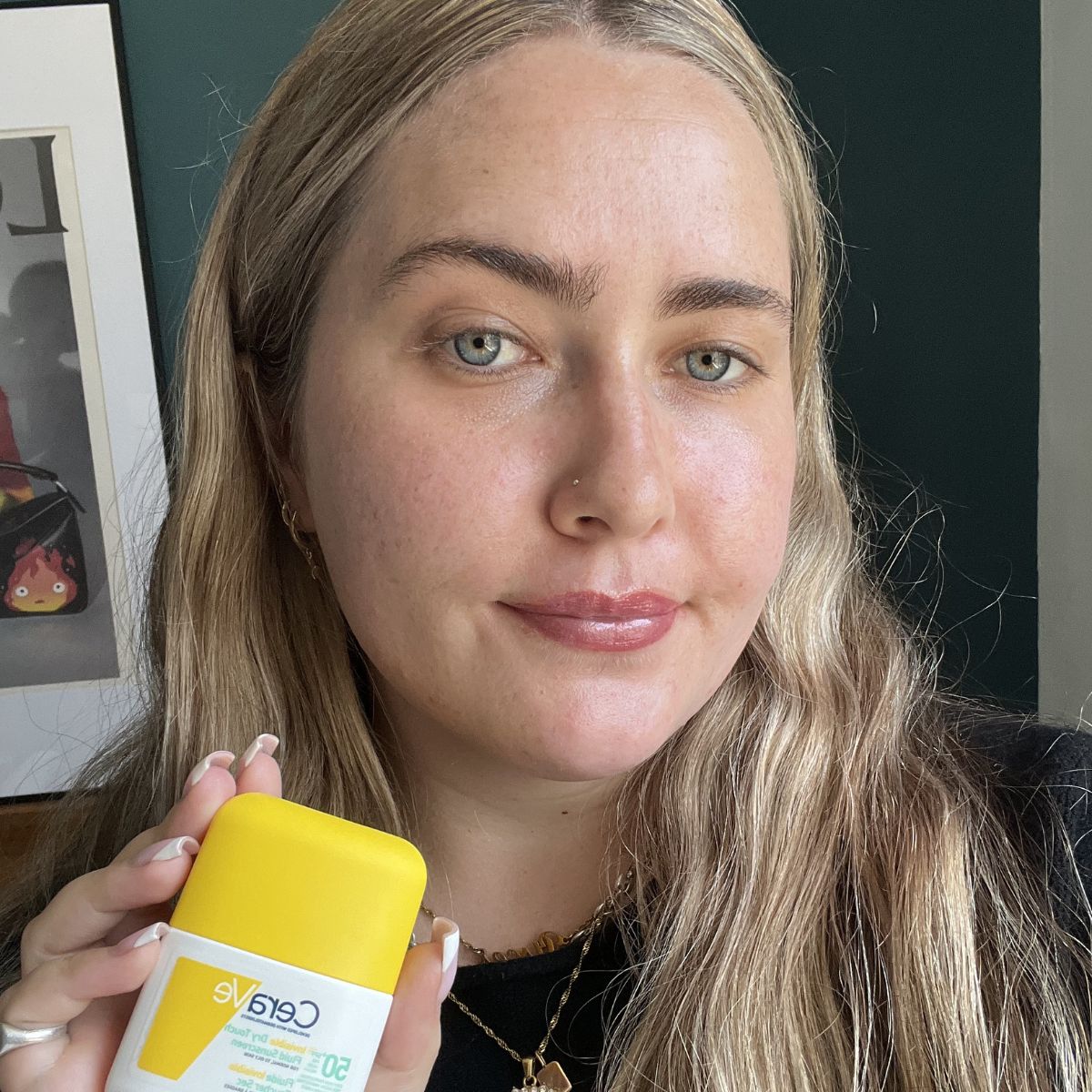 Amelia wearing CeraVe Invisible Dry Touch Fluid Sunscreen SPF50 For Normal To Oily Skin