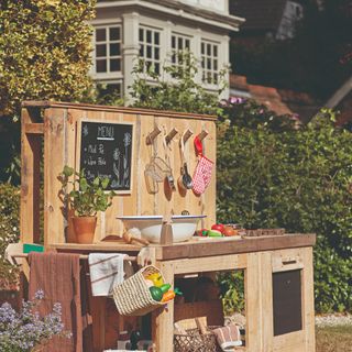 DIY wooden mud kitchen station in garden