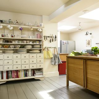 kitchen with open shelves and wooden cabinet
