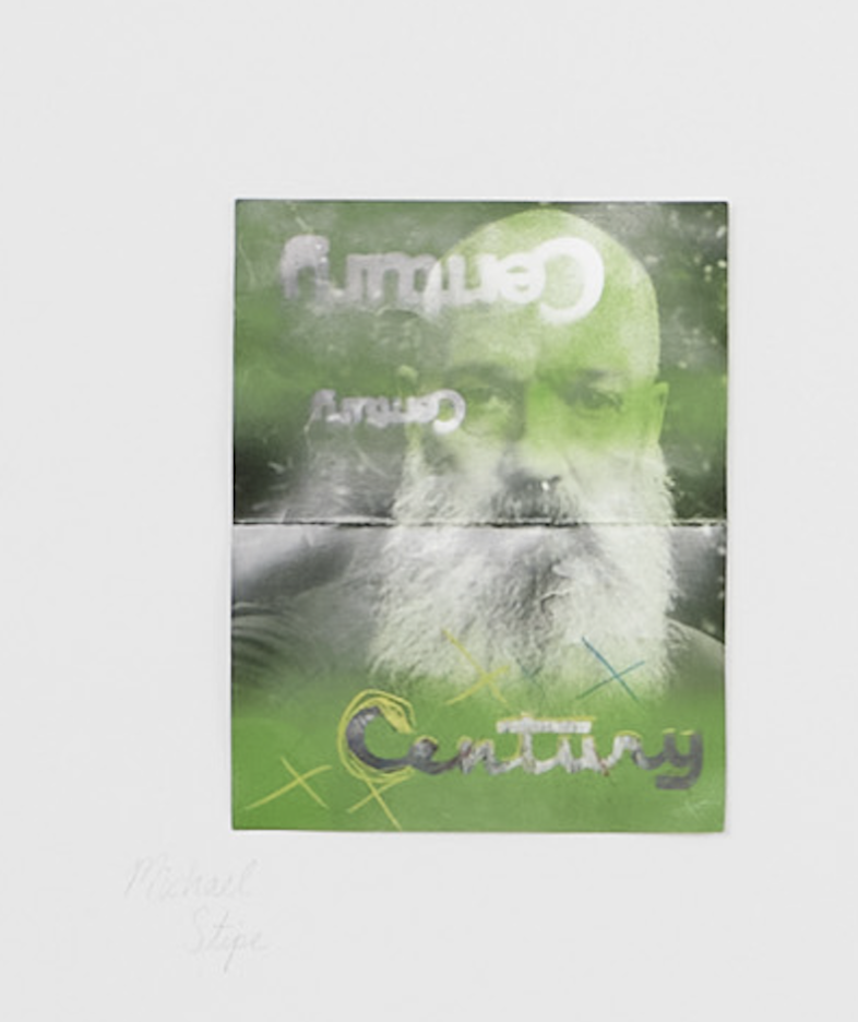 image of man with beard pinned to wall