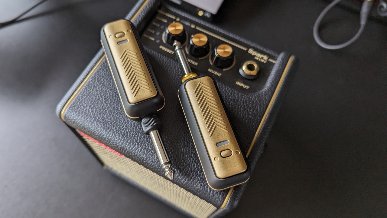A Positive Grid Spark Link guitar wireless system on top of a Positive Grid practice amp