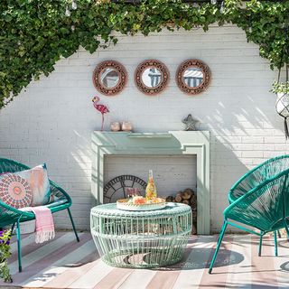 patio area with chairs and plant pots