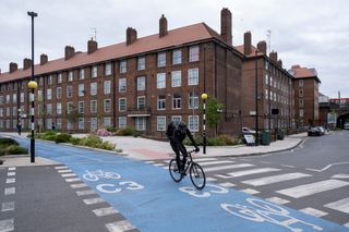 Image of cyclist using semi segregated bike lane in london