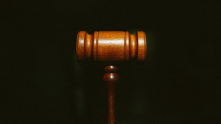 Gavel against a black background