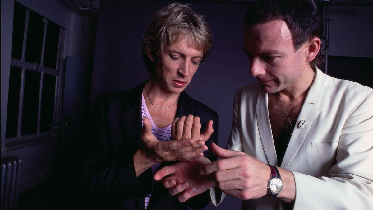 Andy Summers and Robert Fripp looking at their hands