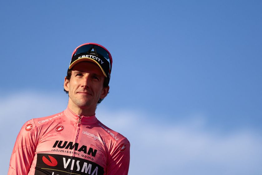 Team Visma-Lease a Bike's British rider Simon Yates wearing the pink jersey of overall leader (Maglia Rosa) celebrates on the podium after the 21st and last stage and winning the 108th Giro d'Italia cycling race of 143kms from Rome to Rome on June 1, 2025. (Photo by Luca Bettini / AFP) (Photo by LUCA BETTINI/AFP via Getty Images)