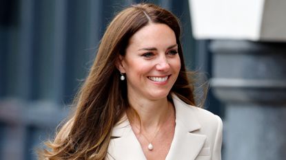 Catherine, Princess of Wales wears a pearl Monica Vinader necklace as she visits the headquarters of the Royal College of Midwives (RCM) and the Royal College of Obstetricians and Gynaecologists (RCOG) on April 27, 2022