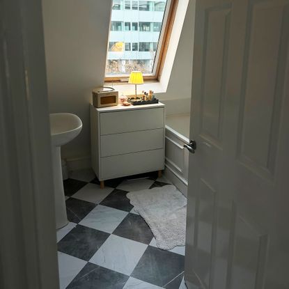 Black and white flooring in bathroom