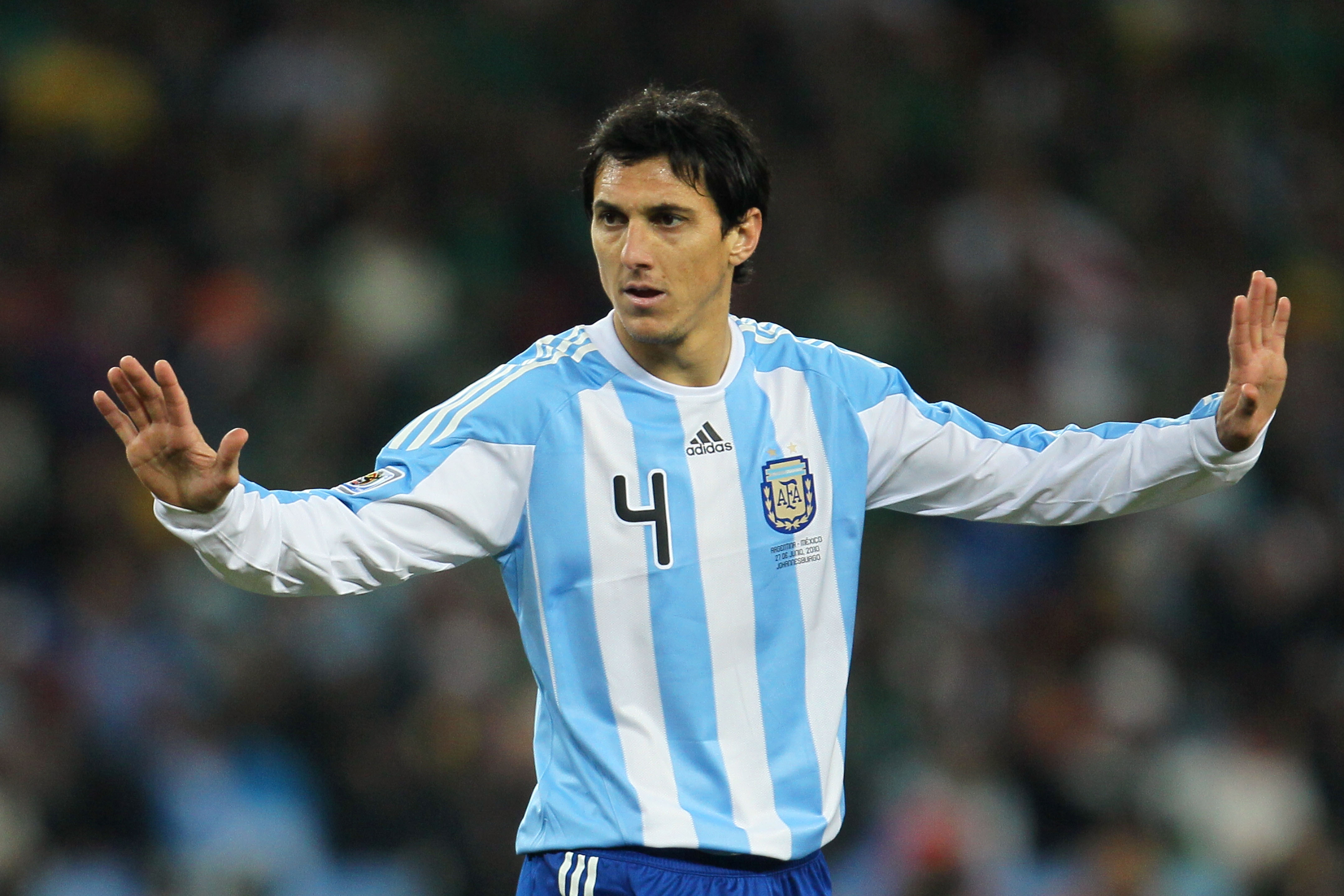 Nicolas Burdisso gestures to his Argentina team-mates during a game against Mexico at the 2010 World Cup.