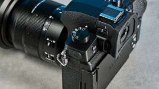 A black Panasonic Lumix G97 mirrorless camera