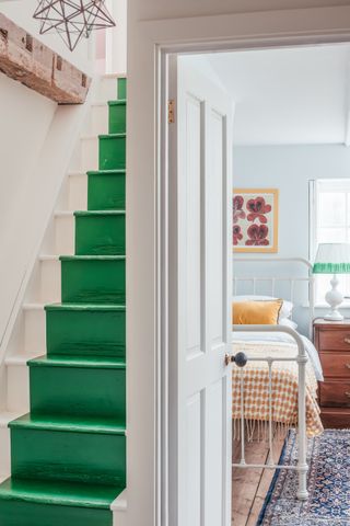 colourful green staircase in a cottage in Kent