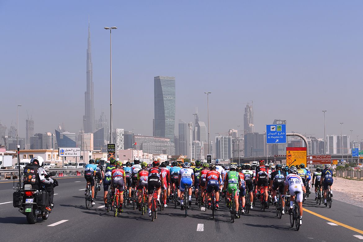 The peloton heads back into the city