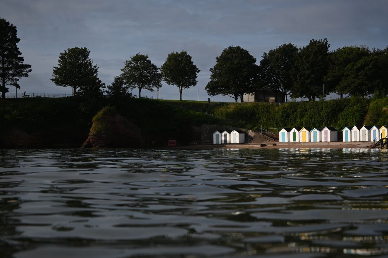 Some beach huts overlooking water, shot on the Nikon Z fc