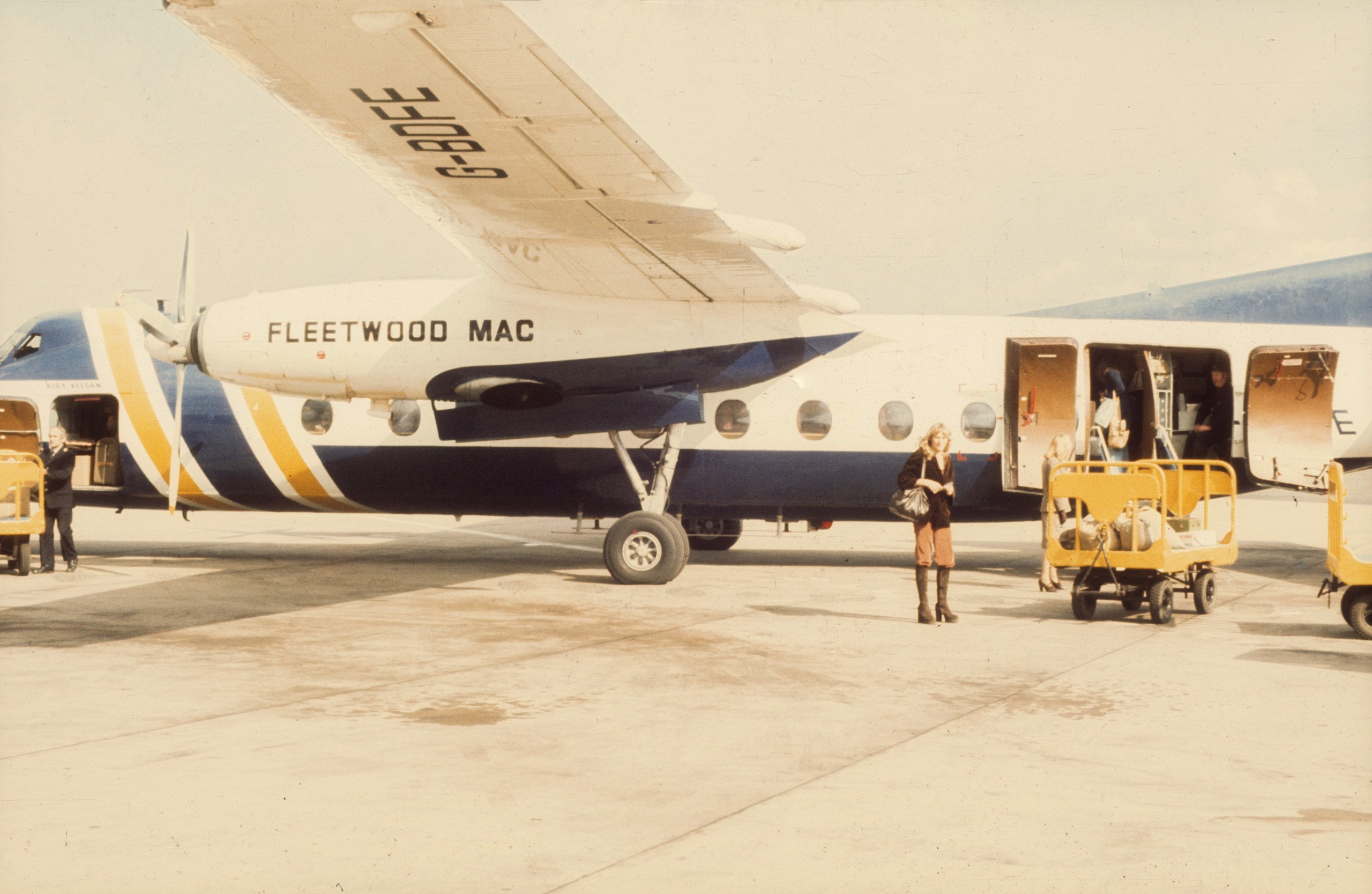 Christine McVie of the Rock group 'Fleetwood Mac' boards their private jet in circa 1975.