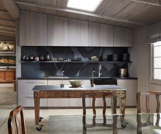 kitchen in open plan living space with vintage island and zinc worktops