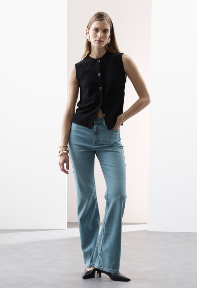 Image of Marks and Spencers spring fashion trend 2026. The model wears the Lyocell Blend High Waisted Flared Jeans.