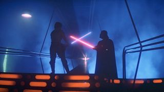 Luke Skywalker and Darth Vader lightsaber dueling in The Empire Strikes Back