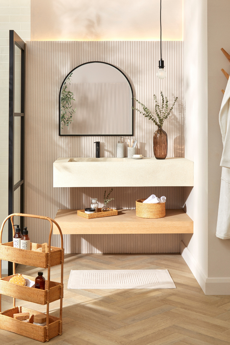 bathroom storage with baskets and caddy