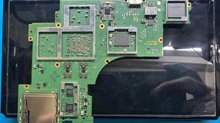 Nintendo Switch 2 leaked motherboard showing PCB in front of tablet system