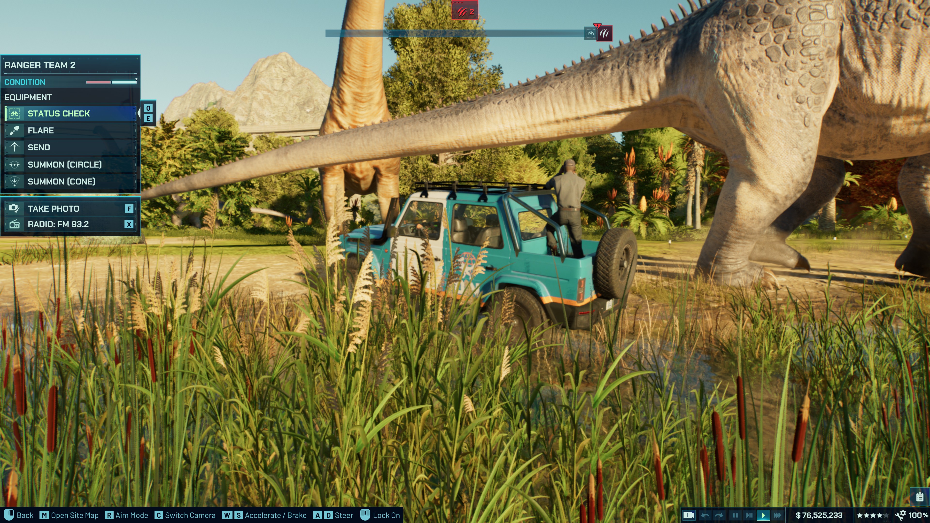A ranger taking a photo of a Patagotitan in Jurassic World Evolution 3.