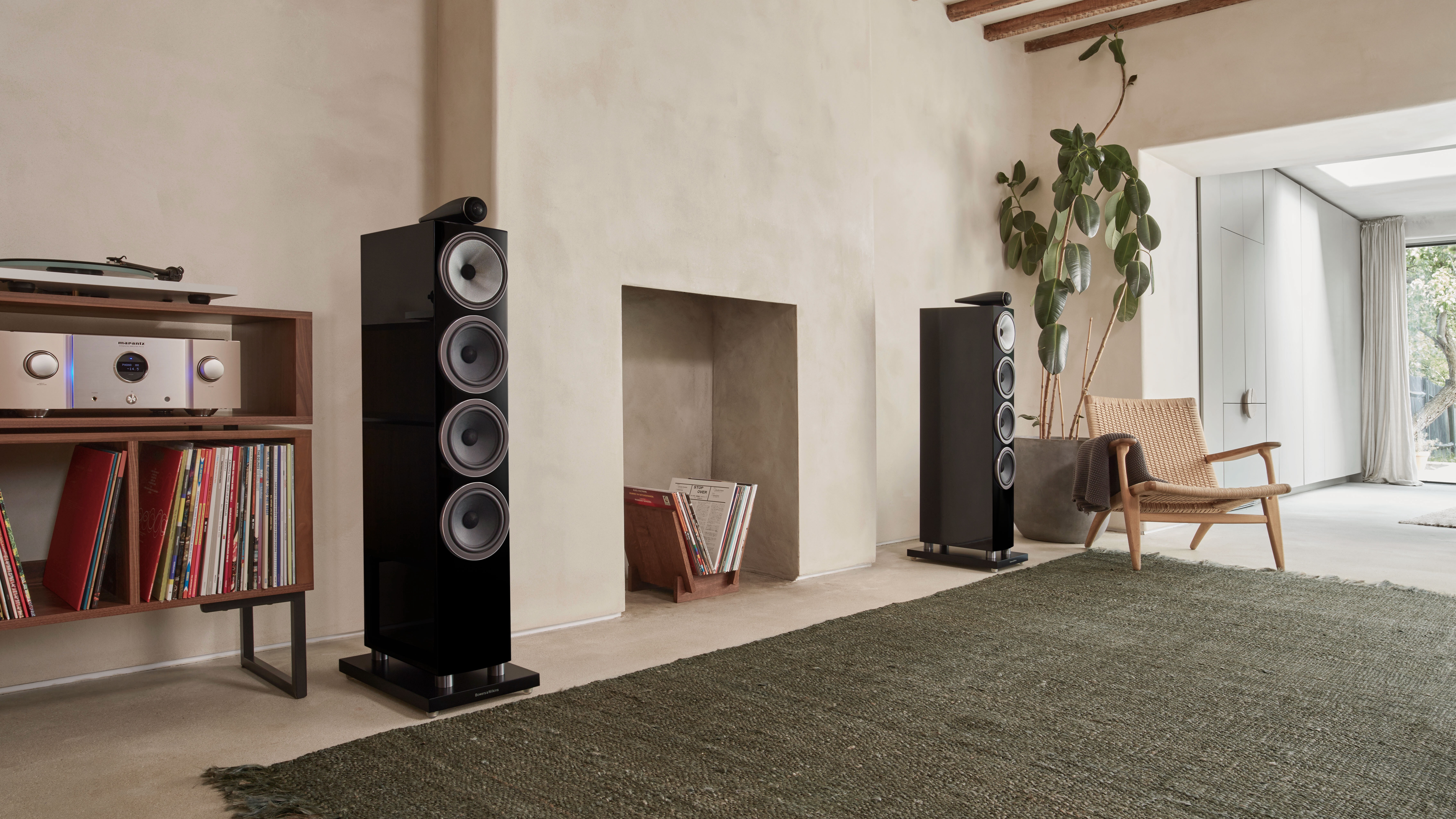 A pair of Bowers &amp;amp; Wilkins 702 S3 speakers either side of a chimney breast in a modern lounge.