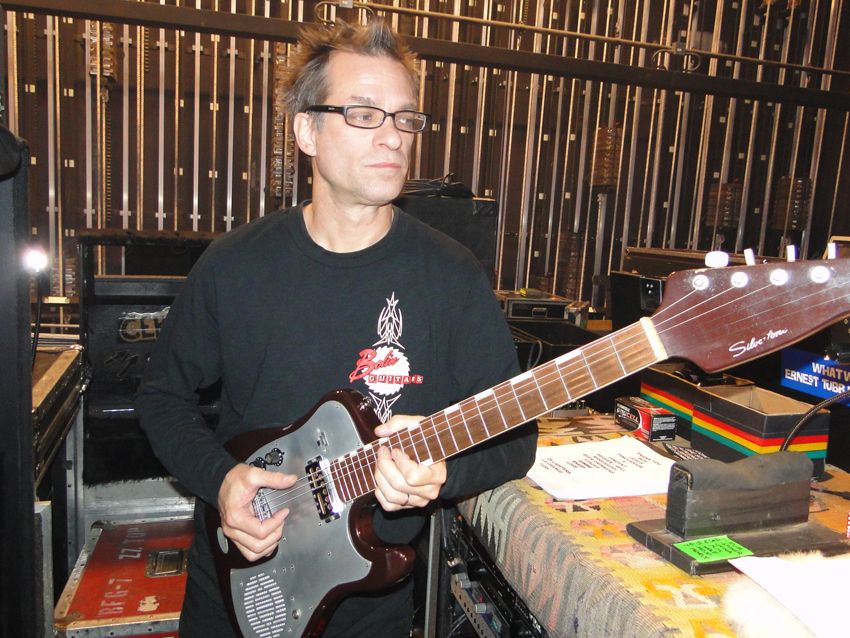 The battery in, Francis gives the Silvertone a few strums