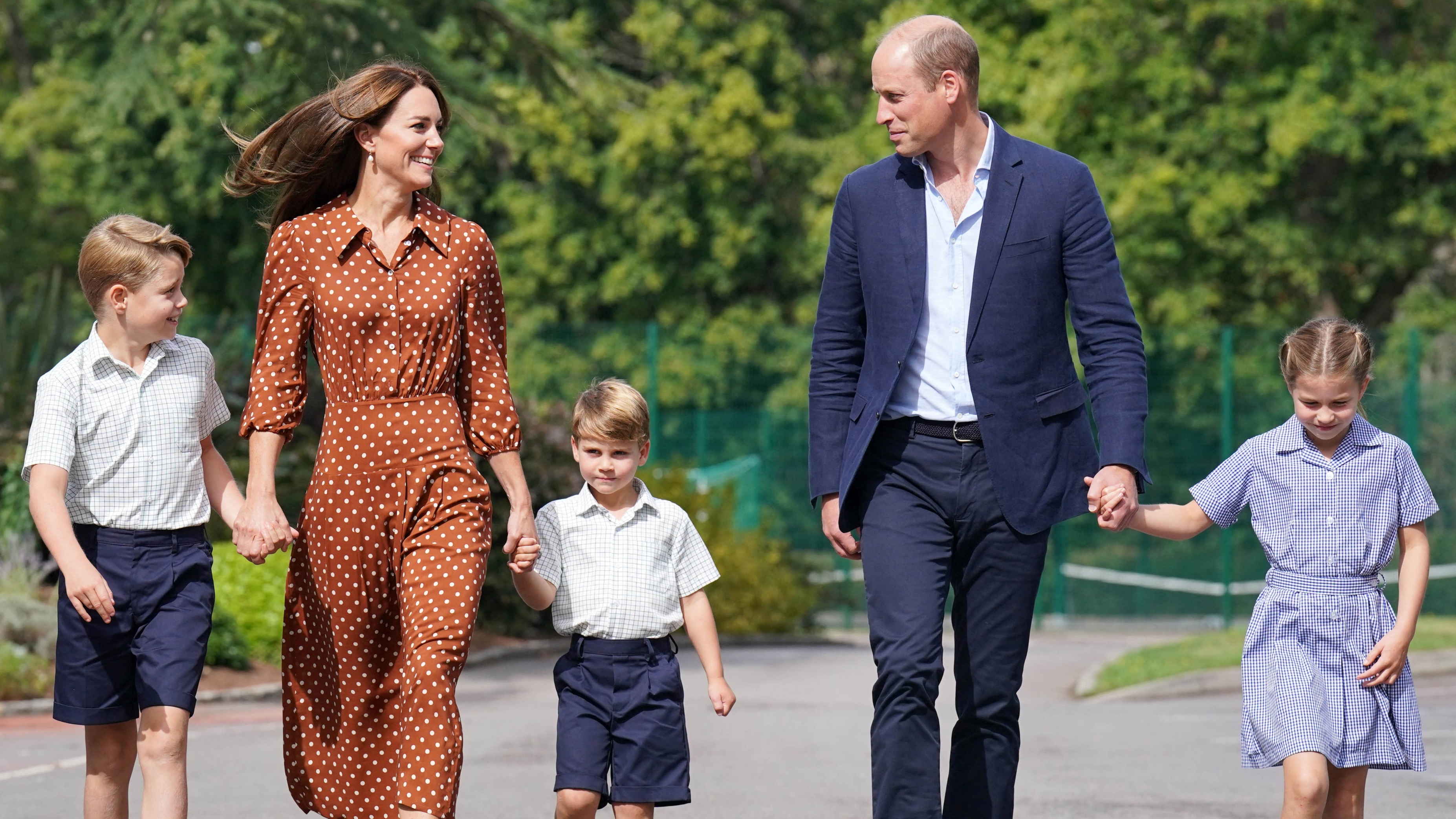 The Wales family hold hands and smile as they arrive at Lambrook School for the kids&#039; settling-in afternoon