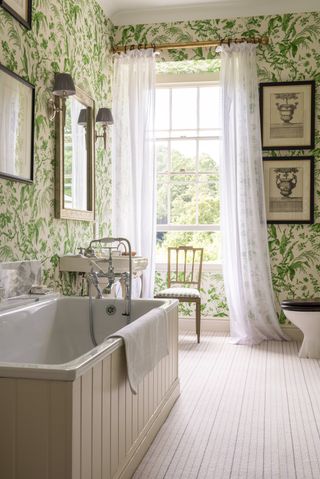 bathroom with floral wallpaper and lace curtains