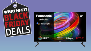 The Panasonic TV is on a purple plain background. In the top left corner is an image of a shopping tag with the words 'What Hi-Fi? Black Friday Deals' in big capital letters.