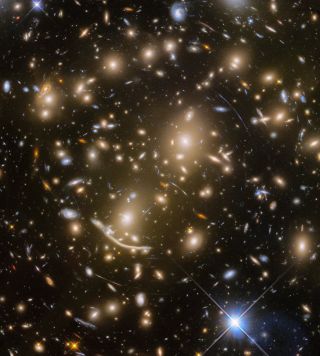 This new Hubble view features a distant galaxy cluster called Abell 370. It also captures numerous cosmic objects that are magnified by the powerful gravitational force of the galaxy cluster.