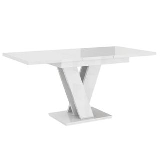 A white marble table with crossed legs