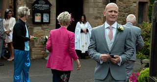 Outside the church, David Metcalfe's hope dwindles as Harriet says she can't wait much longer... Will Tracy make it to the church on time in Emmerdale.