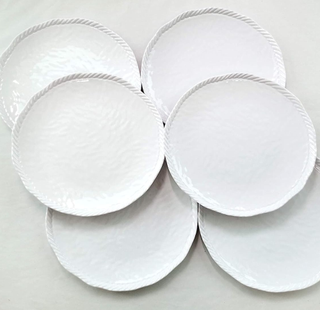 six white textured dinner plates with a rope detail on the rim