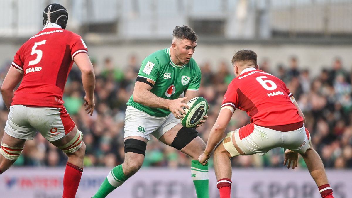 Peter O&#039;Mahony of Ireland in action against Adam Beard, left, and Alex Mann of Wales during Ireland vs Wales in the 2024 Six Nations