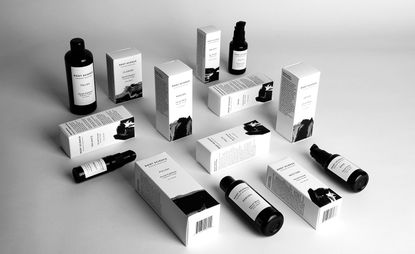 Root Science skincare bottles and boxes diplayed both lying down and standing up