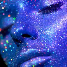 woman with blue glitter on her face