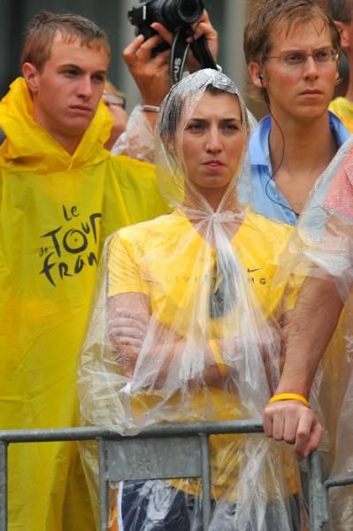 The riders and the spectators got wet in the rain