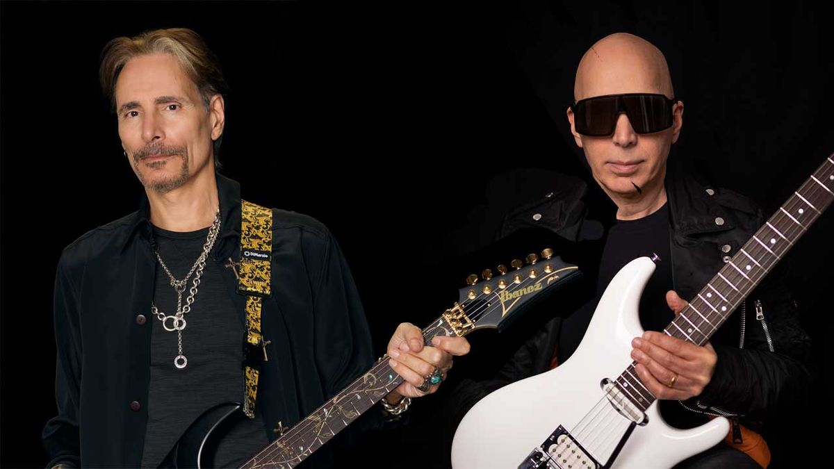 Steve Vai and Joe Satriani holding guitars