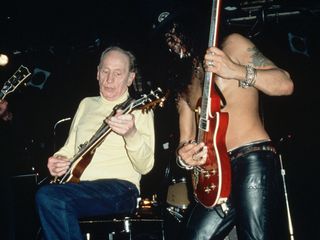 Les Paul and Slash jam onstage in 1996