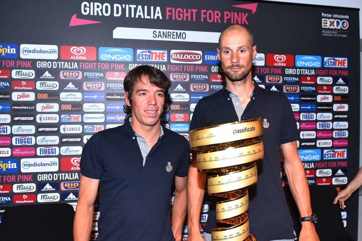Rigoberto Uran and Tom Boonen next to the Giro d'Italia trophy