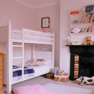 children's bedroom with pink walls and bunk bed