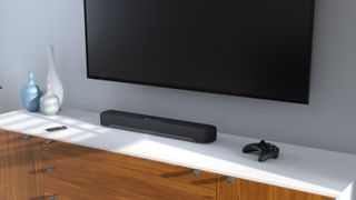 Yamaha SR-C30A on white bench under TV