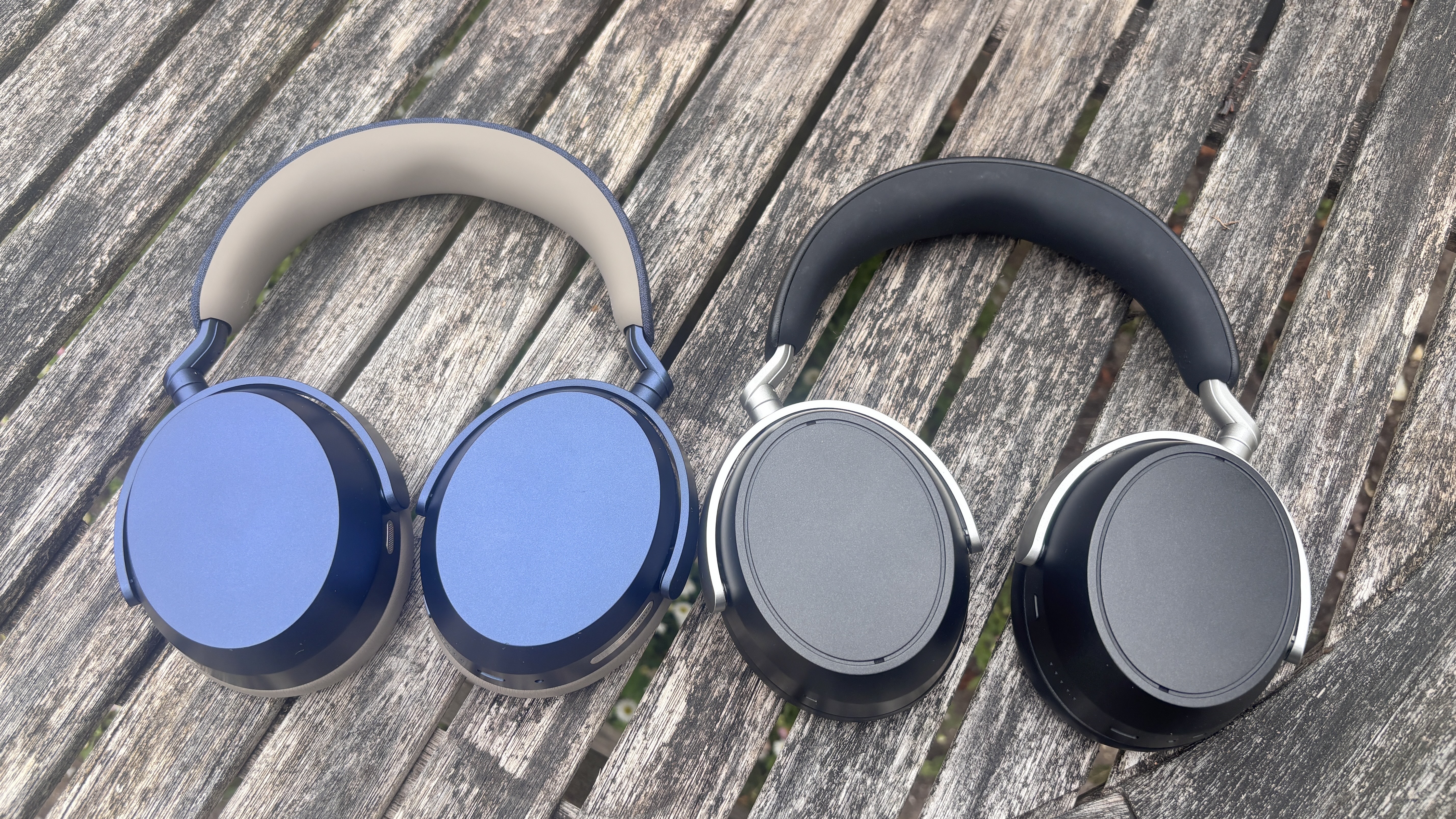 Sennheiser Momentum 5 Wireless and HDB 630 next to each other on a table